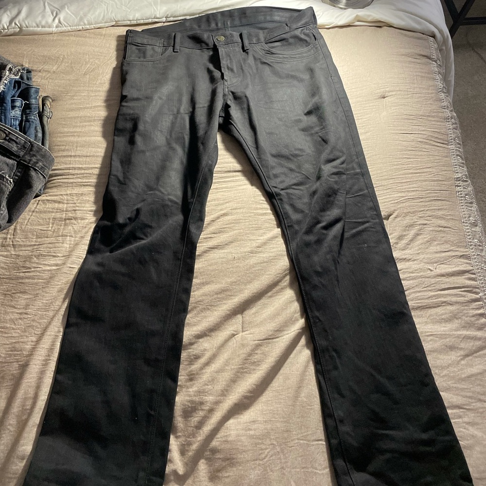 Coated jeans with shiny finish